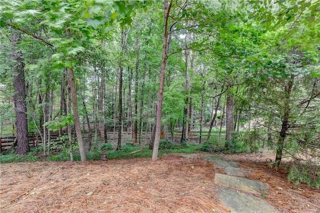 6520 Fairfield Trce, Suwanee, GA 30024 - view of yard with a forest view