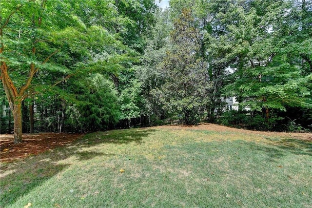 6520 Fairfield Trce, Suwanee, GA 30024 - view of grassy yard featuring a view of trees