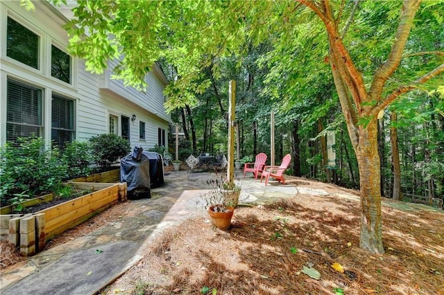 6520 Fairfield Trce, Suwanee, GA 30024 - view of yard with a patio area and a garden