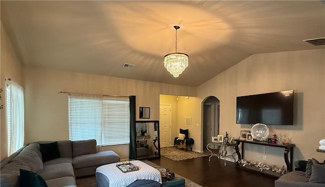 2979 Dungeness Dr, Douglasville, GA 30135 - living area with arched walkways, a chandelier, wood finished floors, and lofted ceiling