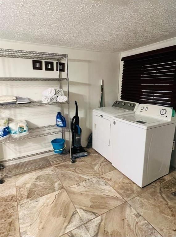 2021 Moody Dr SW, Atlanta, GA 30315 - laundry area featuring independent washer and dryer and a textured ceiling