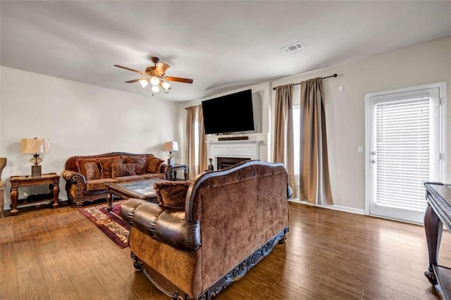 29 Madrid Ave, Newnan, GA 30263 - living room with a ceiling fan, hardwood / wood-style flooring, a fireplace, and baseboards