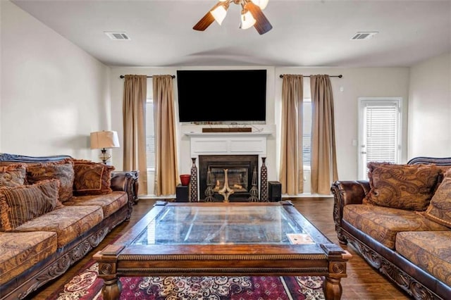 29 Madrid Ave, Newnan, GA 30263 - living area with a ceiling fan, a fireplace with flush hearth, and wood finished floors