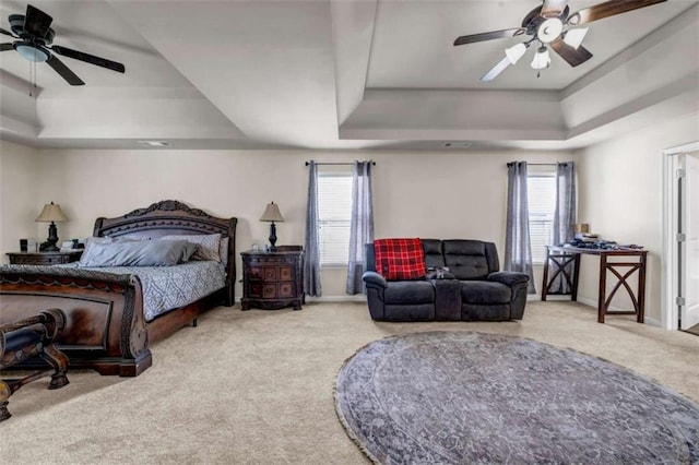 29 Madrid Ave, Newnan, GA 30263 - carpeted bedroom with a tray ceiling, multiple windows, baseboards, and a ceiling fan