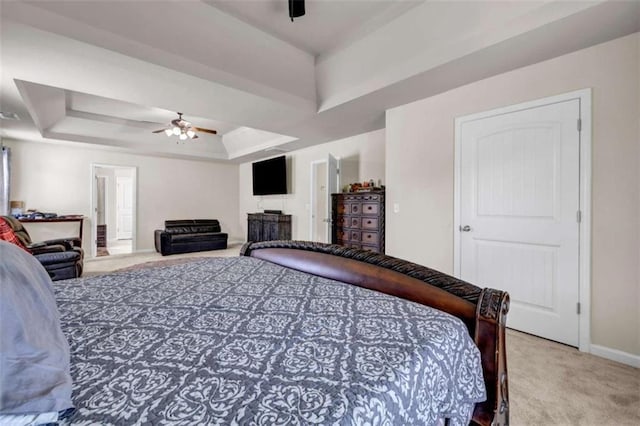 29 Madrid Ave, Newnan, GA 30263 - bedroom with carpet floors, a tray ceiling, baseboards, and a ceiling fan
