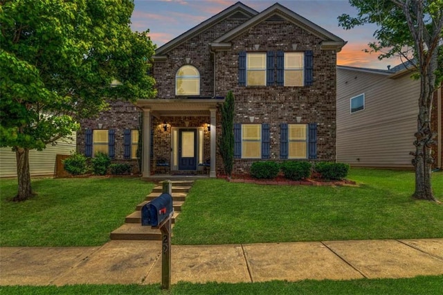 29 Madrid Ave, Newnan, GA 30263 - traditional-style home featuring brick siding and a yard