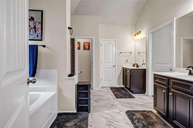 29 Madrid Ave, Newnan, GA 30263 - full bath with a garden tub, two vanities, and baseboards