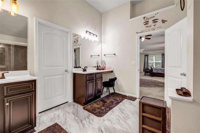 29 Madrid Ave, Newnan, GA 30263 - ensuite bathroom featuring vanity, ceiling fan, a shower, baseboards, and marble look tile flooring