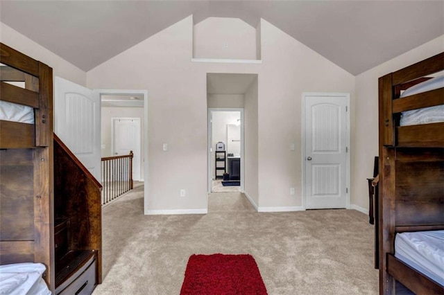 29 Madrid Ave, Newnan, GA 30263 - unfurnished bedroom with light colored carpet, baseboards, and high vaulted ceiling