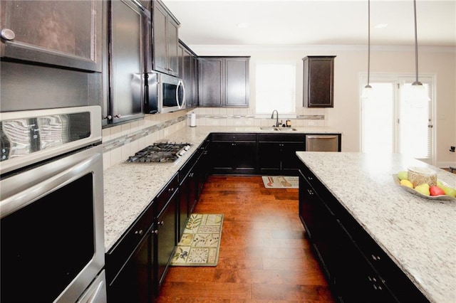 4594 Marching Ln, Fairburn, GA 30213 - kitchen featuring light stone counters, decorative light fixtures, a sink, stainless steel appliances, and backsplash