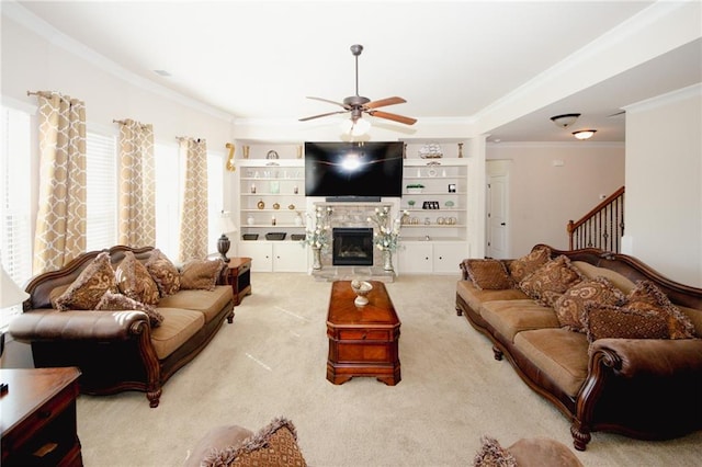 4594 Marching Ln, Fairburn, GA 30213 - carpeted living room with crown molding, a ceiling fan, a wealth of natural light, and a stone fireplace