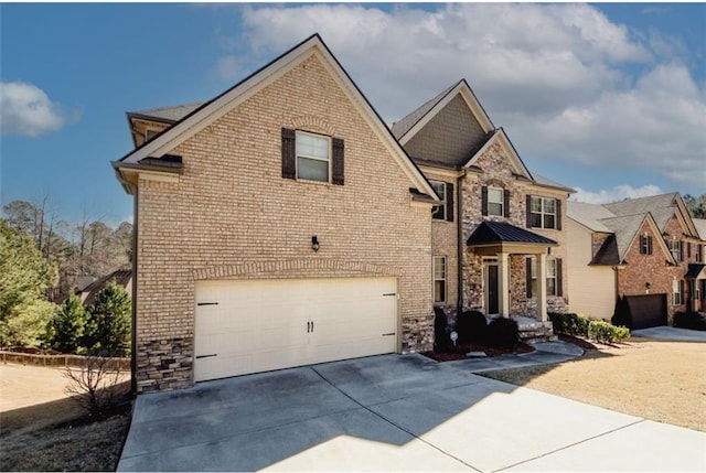 4594 Marching Ln, Fairburn, GA 30213 - view of front facade with a garage, concrete driveway, brick siding, and stone siding