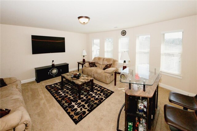 4594 Marching Ln, Fairburn, GA 30213 - living area featuring baseboards and light colored carpet