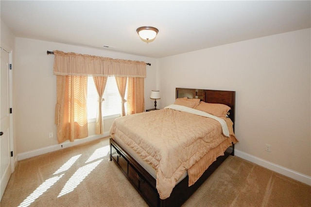 4594 Marching Ln, Fairburn, GA 30213 - bedroom featuring light carpet, visible vents, and baseboards
