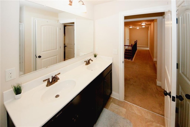 4594 Marching Ln, Fairburn, GA 30213 - bathroom featuring double vanity, a sink, and baseboards