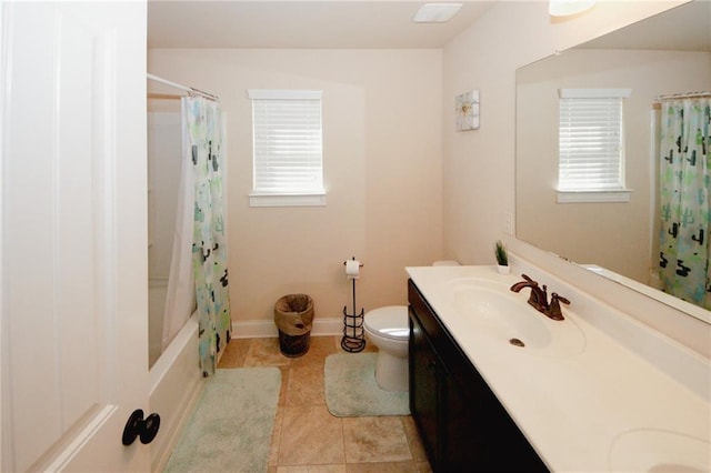 4594 Marching Ln, Fairburn, GA 30213 - full bath featuring shower / tub combo with curtain, double vanity, toilet, a sink, and baseboards