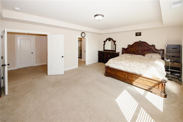 4594 Marching Ln, Fairburn, GA 30213 - bedroom featuring a tray ceiling, light colored carpet, and baseboards