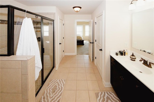 4594 Marching Ln, Fairburn, GA 30213 - ensuite bathroom with ensuite bathroom, vanity, baseboards, a shower stall, and tile patterned floors
