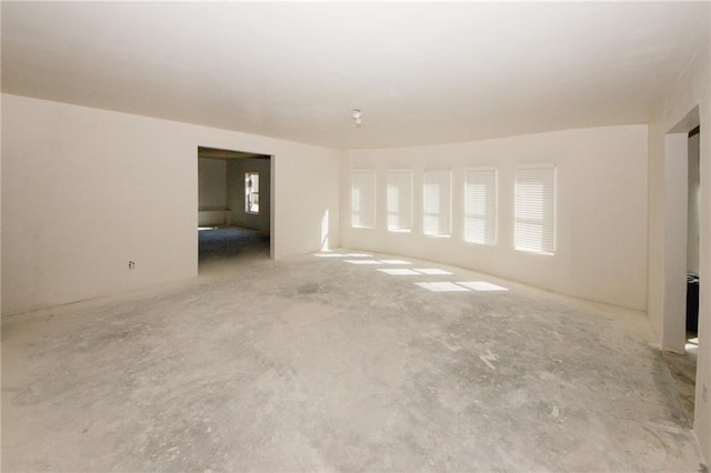 4594 Marching Ln, Fairburn, GA 30213 - unfurnished living room with concrete floors