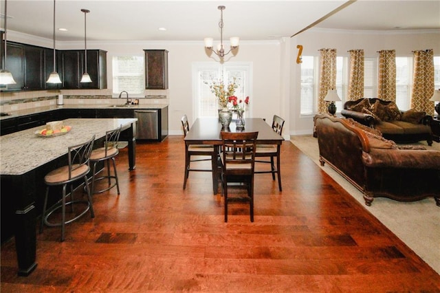 4594 Marching Ln, Fairburn, GA 30213 - dining area with dark wood-style flooring, recessed lighting, an inviting chandelier, ornamental molding, and baseboards