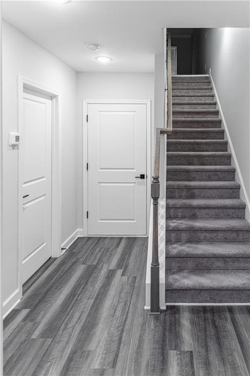 stairway featuring hardwood / wood-style flooring