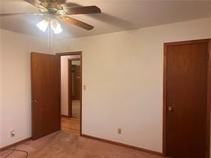 unfurnished bedroom with ceiling fan