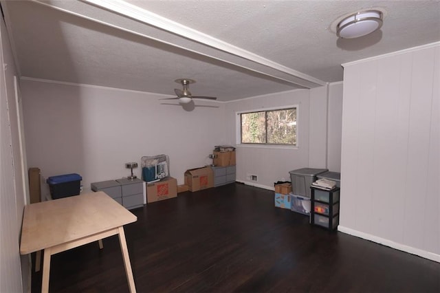 interior space featuring ornamental molding, a textured ceiling, ceiling fan, and dark wood-type flooring