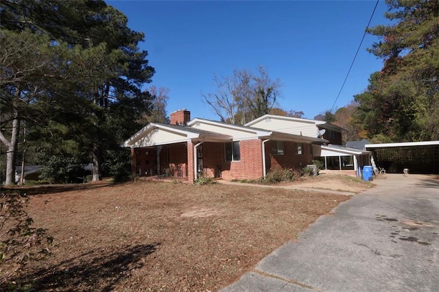 bungalow featuring a carport