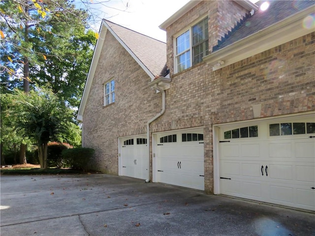 view of side of home with a garage