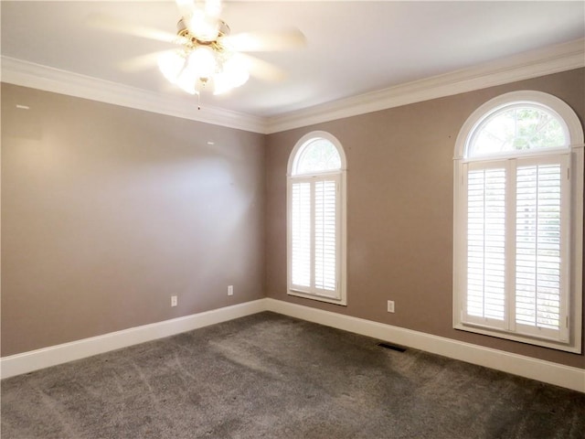 carpeted spare room featuring ornamental molding and ceiling fan