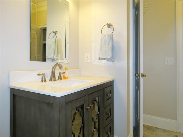 bathroom featuring vanity and ornamental molding