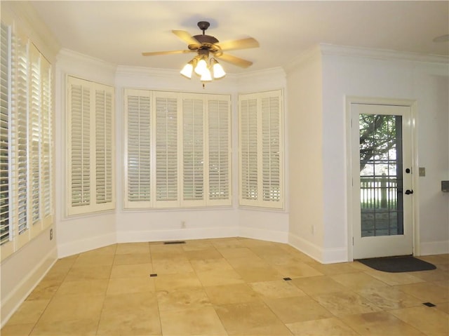 unfurnished dining area featuring ceiling fan and ornamental molding