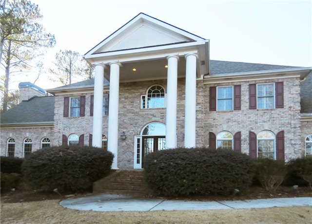 view of greek revival inspired property