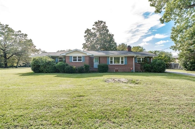 ranch-style house featuring a front lawn