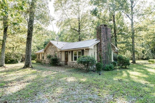 view of side of home featuring a lawn