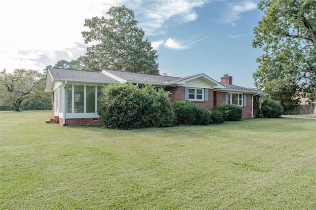 ranch-style house featuring a front lawn