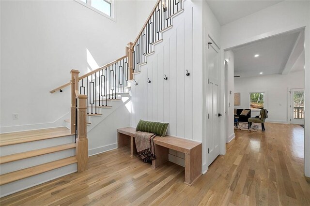 stairway featuring hardwood / wood-style flooring