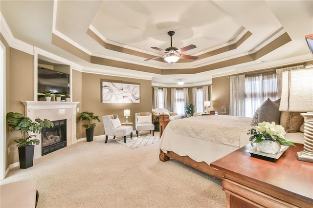 2727 Lost Mill Trce, Buford, GA 30519 - carpeted bedroom featuring a ceiling fan, ornamental molding, a tile fireplace, and a tray ceiling