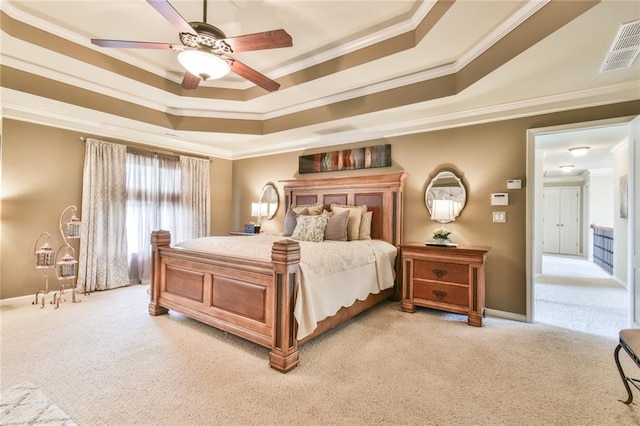 2727 Lost Mill Trce, Buford, GA 30519 - bedroom with visible vents, a tray ceiling, baseboards, ornamental molding, and light carpet