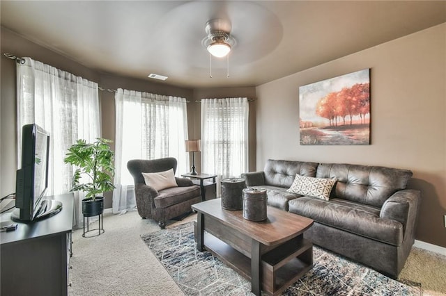 2727 Lost Mill Trce, Buford, GA 30519 - carpeted living area featuring baseboards, visible vents, and a ceiling fan