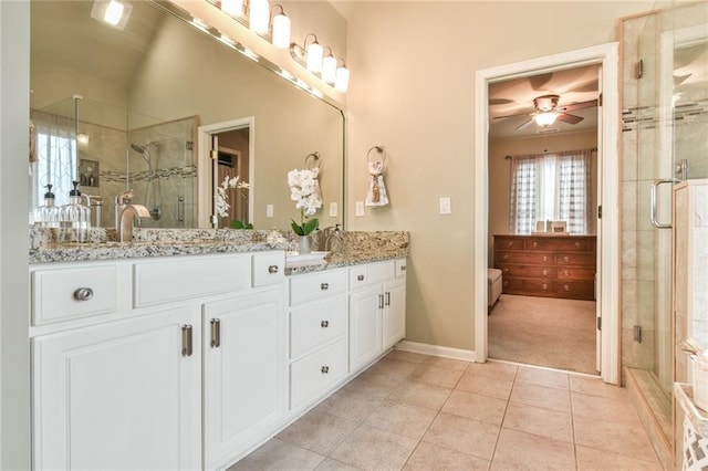 2727 Lost Mill Trce, Buford, GA 30519 - full bathroom featuring double vanity, ceiling fan, a shower stall, and tile patterned flooring