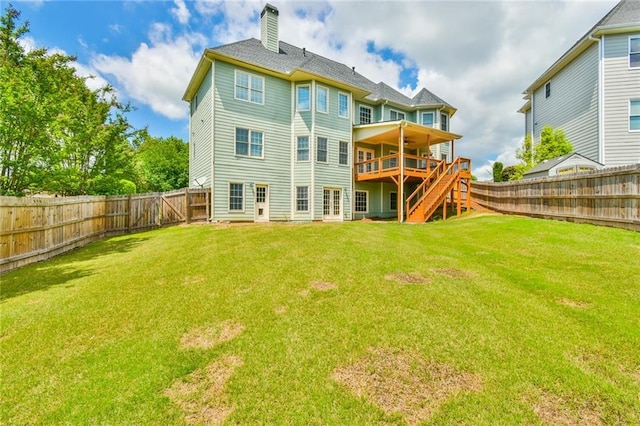 2727 Lost Mill Trce, Buford, GA 30519 - rear view of house featuring a lawn, a deck, a fenced backyard, and a chimney