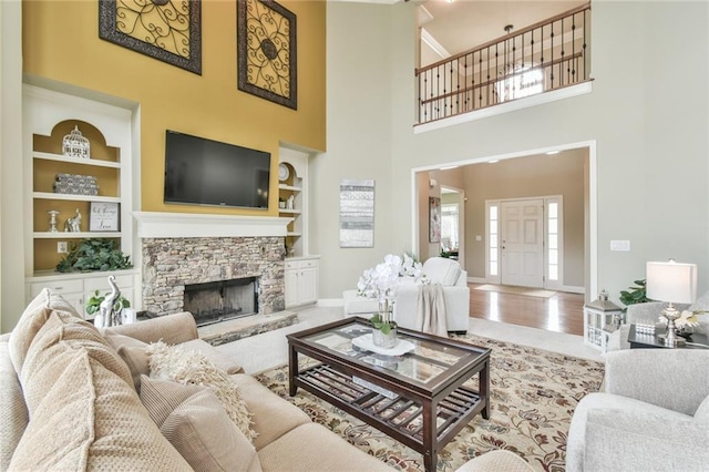 2727 Lost Mill Trce, Buford, GA 30519 - living area with baseboards, built in shelves, and a towering ceiling