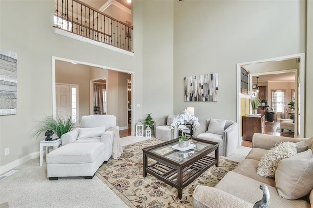 2727 Lost Mill Trce, Buford, GA 30519 - carpeted living room featuring baseboards and a high ceiling