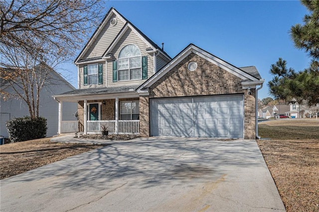 view of front property with a porch and a garage