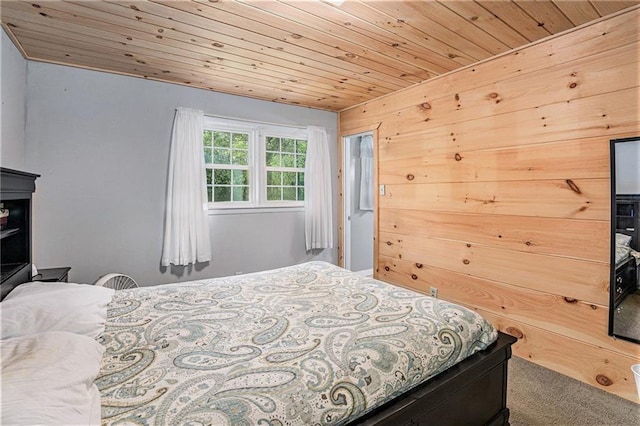 carpeted bedroom featuring wood ceiling