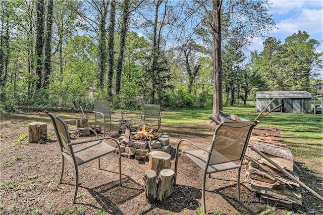view of yard with an outdoor fire pit