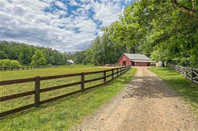 view of gate with a rural view