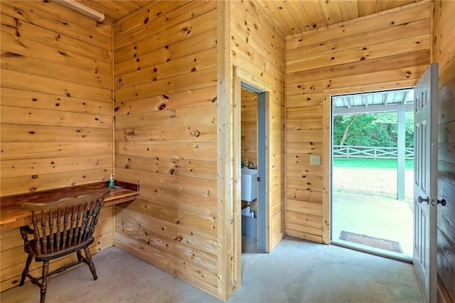 office area featuring wooden walls and wooden ceiling