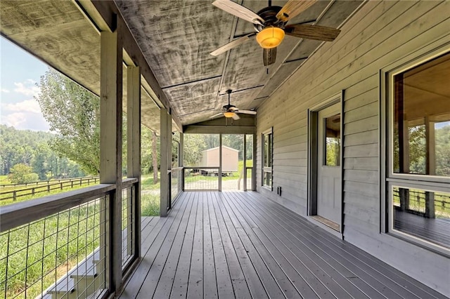 deck with ceiling fan and a porch